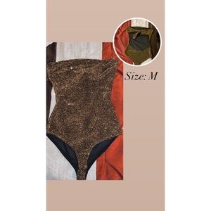 Gold and black glittery body suit